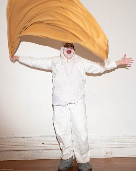 Torn in white costume waves yellow cloth